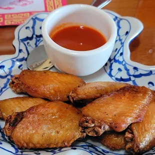 Sweet wings with Sriracha sauce.