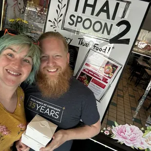 Happy customers taking the big portions home in boxes!