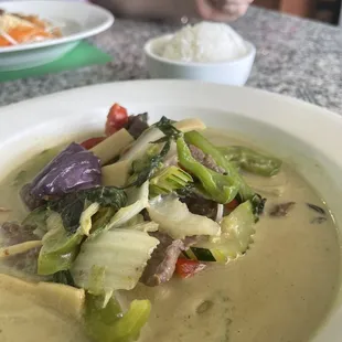 a bowl of soup and a plate of rice