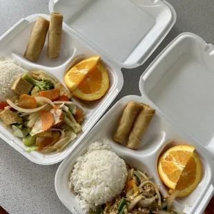 two trays of food on a table