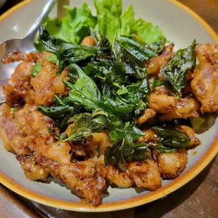 a plate of chicken and greens