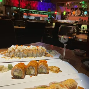 Top is Coconut Roll--Coconut shrimp, avocado, lobster salad, crab, caviar, spicy Mayo and crunch!