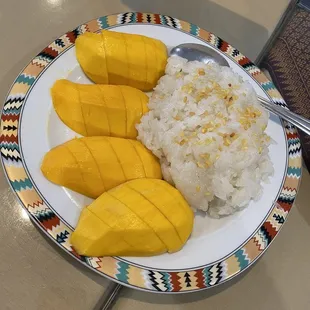 a plate of mangoes and rice