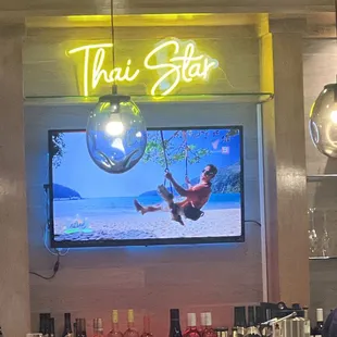 a man on a swing in a restaurant