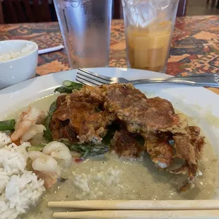 Half eaten soft shell crab in green sauce.