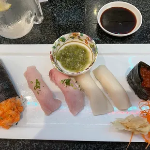 Scallop hand roll with the Masago eggs Yellowtail , escolar and ikura