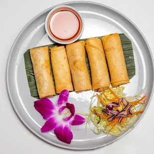 a plate of food with dipping sauce