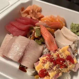  variety of sushi in a styrofoam container
