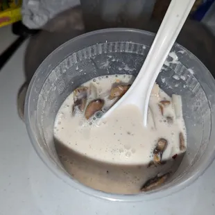 a spoon in a bowl of food