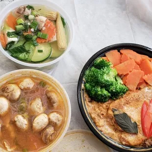a bowl of soup and a bowl of vegetables