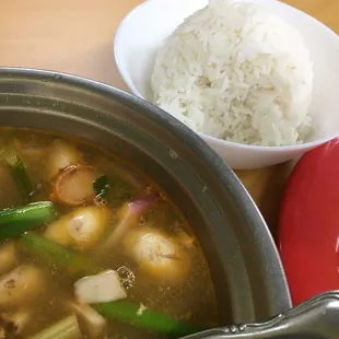 Bowl of tom yum with shrimp and comes with non-jasmine rice