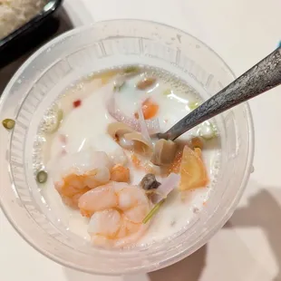 The best Tom Kha ever ordered. Thick white creamy and beautiful ingredients. With Shrimp. It&apos;s a deep container.