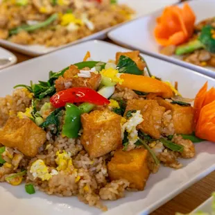 a plate of fried tofu and vegetables