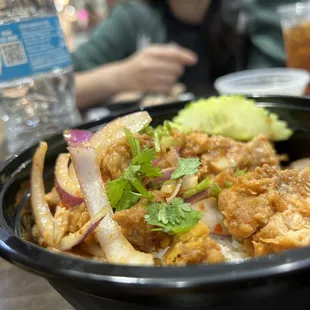 a woman sitting in the background