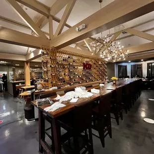 a long wooden table with chairs