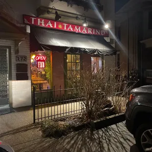 the front of a restaurant at night