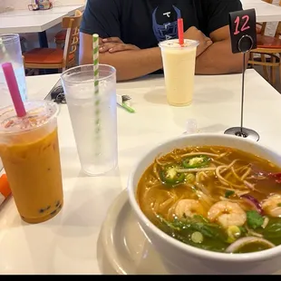 pho noodle soup with shrimp !     Thai tea flavor boba tea, the yellow drink in the background is a pina colada slush.