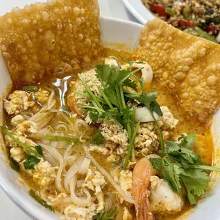 a bowl of soup and a plate of rice