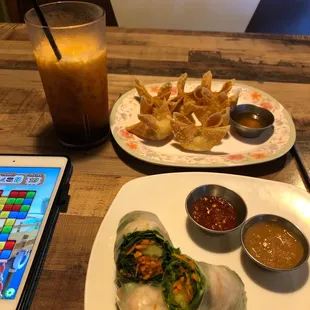 Fresh spring rolls, crab Ragu noon and a Thai tea. Waiting on my drunken noodles. I love this place