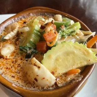 a bowl of soup on a plate