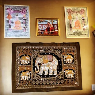 an elephant and other decorations on a wall