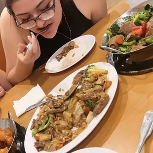 Orange chicken, pad see ew and basil beef.