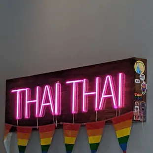 a neon sign on a wall