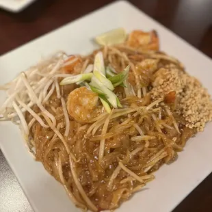 a plate of noodles and shrimp