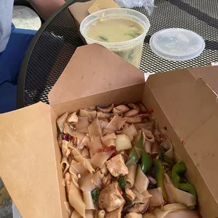 Chicken drunken noodles and green curry with chicken