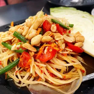 a plate of noodles and vegetables