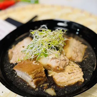 Oki pork belly served with rice . chef special