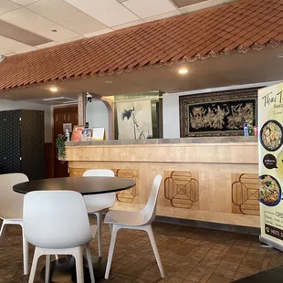 a restaurant with tables and chairs