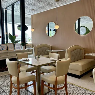a dining area with a table and chairs