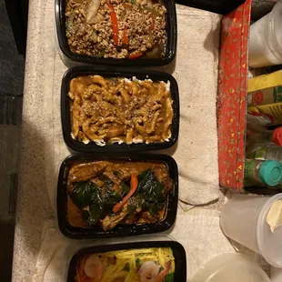My takeout - from left to right Kao Pad Kra Prow (ground chicken), Pra Ram Long Song, 58. Thai Time Wings, and Mango Salad