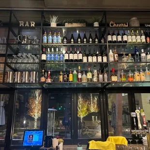 a bar with many bottles of alcohol