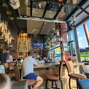 Garage door opened that shows patio and the marvelous blue sky in the background.