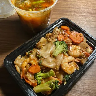 ows a meal in a takeout container