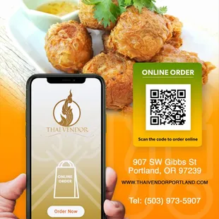 a hand holding a phone with a qr code on it