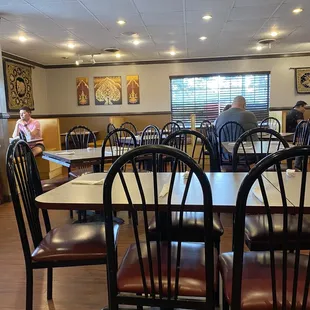 a dining room with tables and chairs