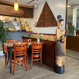 a statue of a woman in a restaurant
