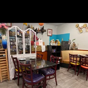 a dining area with tables and chairs