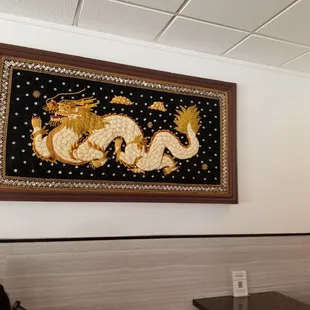 a picture of a dragon on the wall
