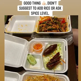 a picture of a meal in a takeout box