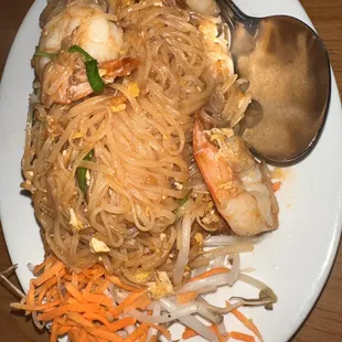 a plate of noodles and shrimp