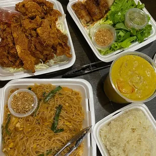 Fried chicken, spring rolls, pad Thai with tofu, yellow curry with pork, and sticky rice