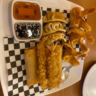 a plate of fried food and dipping sauce
