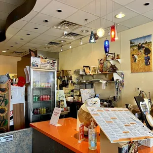 a restaurant counter with a menu