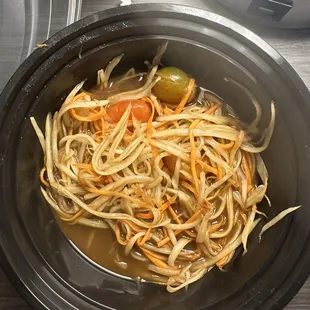 a bowl of noodles and vegetables