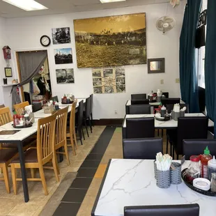 a restaurant with tables and chairs
