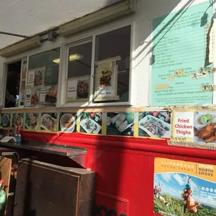 a food truck with posters on the side